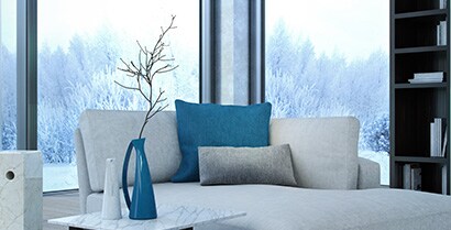 The view of a wintery scene from the family room window is a reminder that window films can help keep the cold outside.
