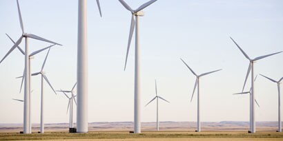 Wind farm on a farm/dessert landscape.
