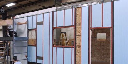 Image of the side panel of a trailer with VHB tape applied
