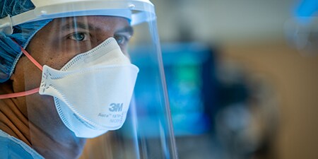 Clinician wearing PPE
