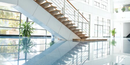 Bright and shiny office staircase with polished floors.
