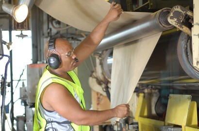 Workman wearing noise cancelling headset