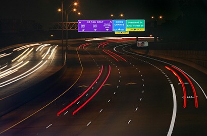 Nighttime highway showing diamond grade reflective tape.