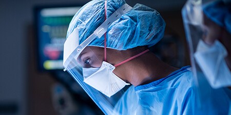 Clinician wearing a filtering facepiece respirator
