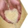 Plastic pellets for industrial manufacturing use held in cupped hands.