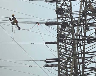 Image of electrial tower with a new kind of cable called 3M  Aluminum Conductor Composite Reinforced, or ACCR.