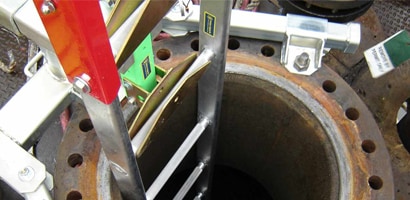 Ladder system installed in vertical confined space access port
