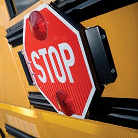 School bus stop sign with conspicuity
