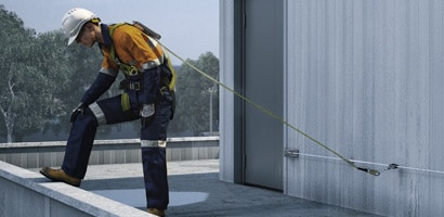 3M Permanent Horizontal Permanent Lifeline in use on a rooftop ledge
